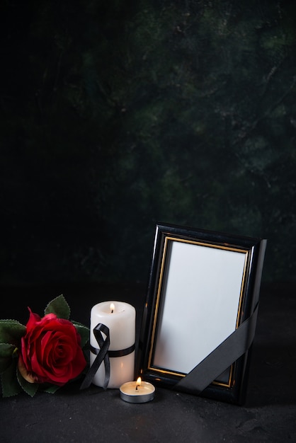 Front view of picture frame with red flower on black