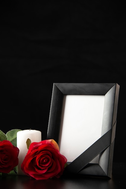 Front view of picture frame with red flowers on black