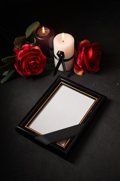 Front view picture frame with red flowers on dark surface