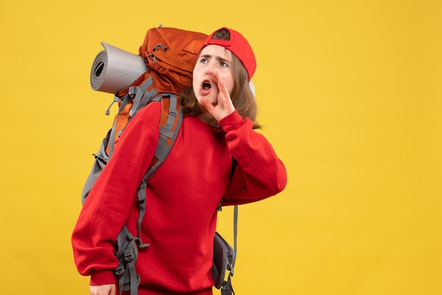 Front view pretty female traveler with backpack calling someone