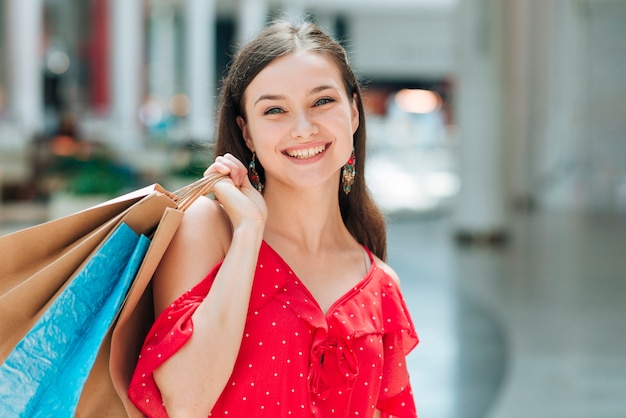 Free Photo front view pretty girl at shopping mall