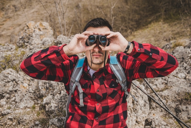 Free Photo front view of rambler with binoculars