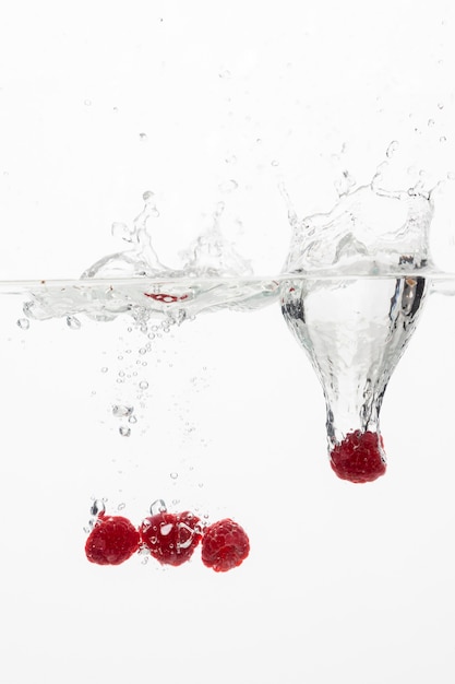 Front view of raspberries in water