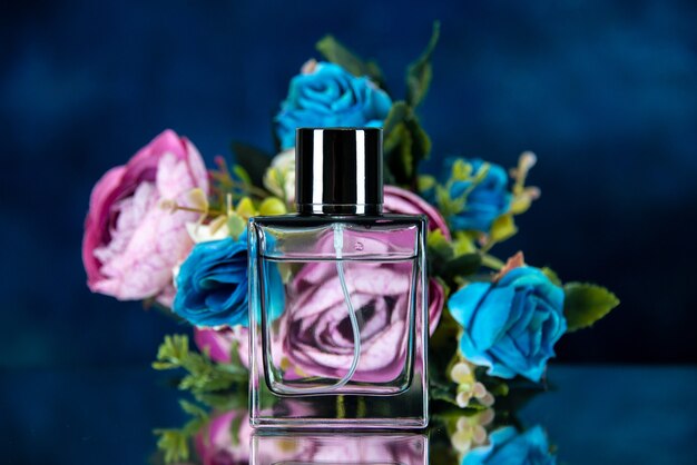 Front view of rectangle perfume bottle colored flowers on dark blue