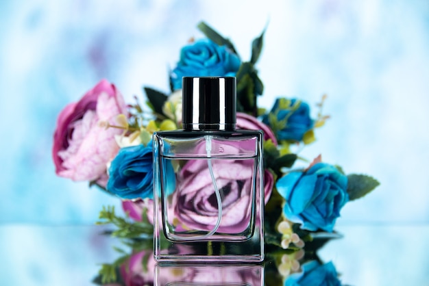 Front view of rectangle perfume bottle colored flowers on light blue