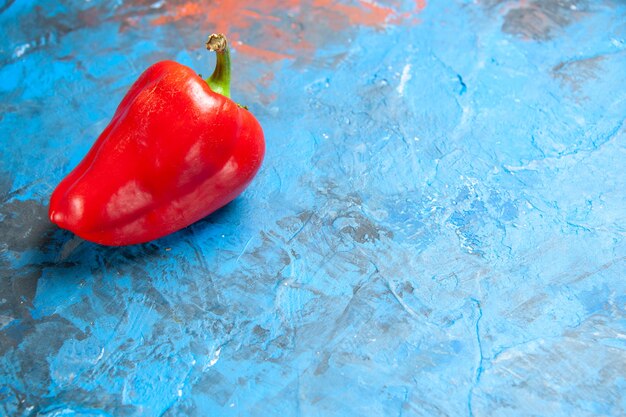 Front view red bell-pepper on blue table color photo food salad vegetables