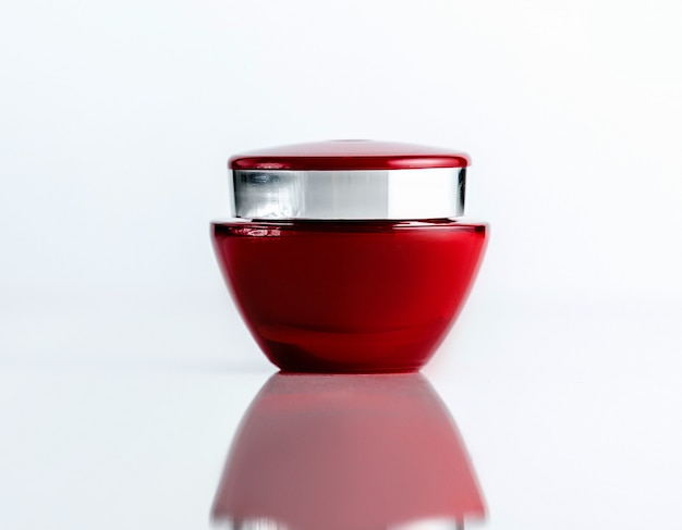 Free Photo front view red cosmetic cream jar