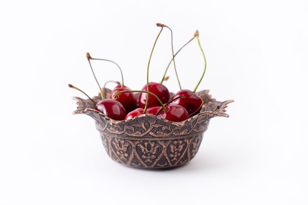 Free photo front view red sour cherries inside plate on white