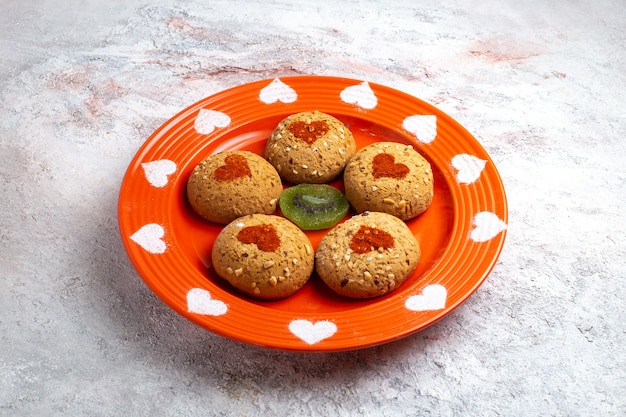 Free Photo front view round sugar cookies inside plate on white surface cookie biscuit sugar sweet cake