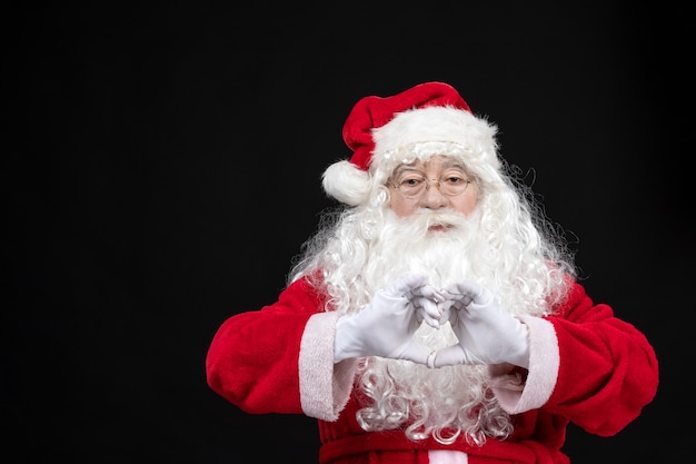 Free Photo front view santa claus in classic red suit with white beard