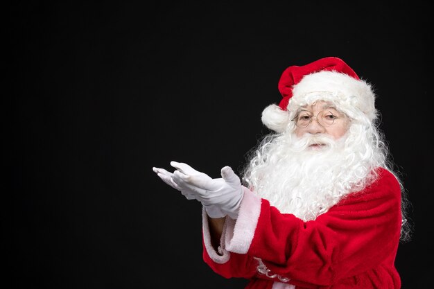 Free photo front view santa claus in classic red suit