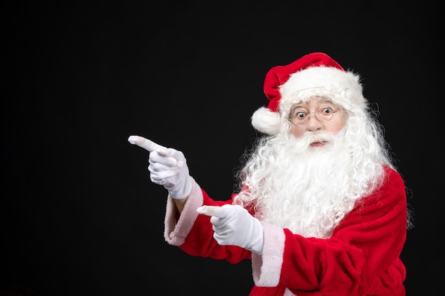 Free photo front view santa claus in classic red suit