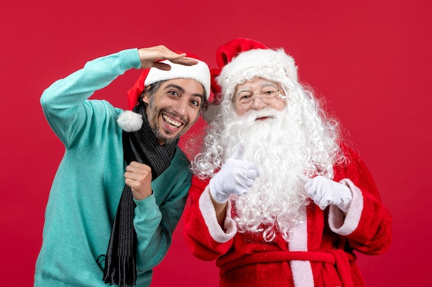 Front view santa claus with young male just standing