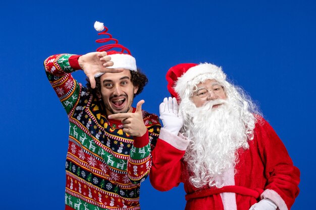 Front view santa claus with young male just standing