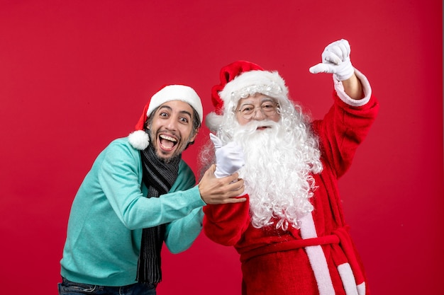 Front view santa claus with young male just standing