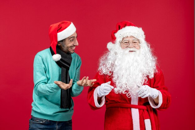 Front view santa claus with young male just standing