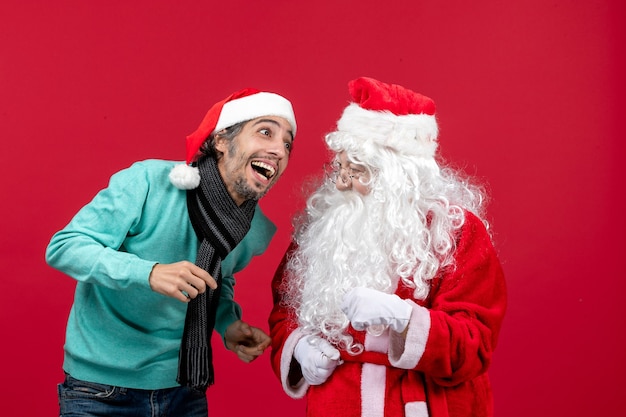 Front view santa claus with young male just standing