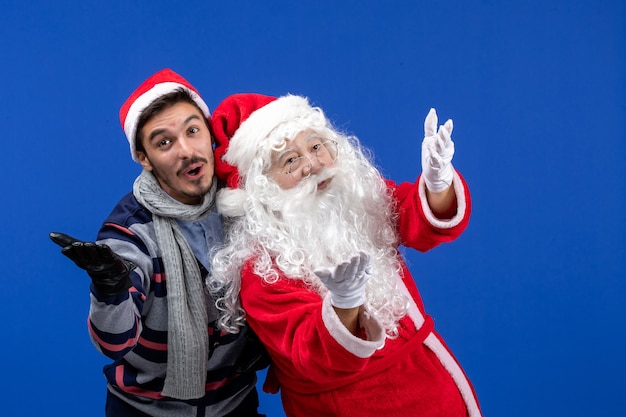 Front view santa claus with young male