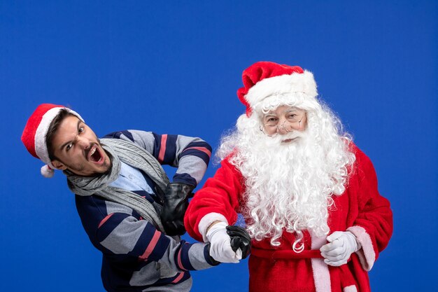 Front view santa claus with young male