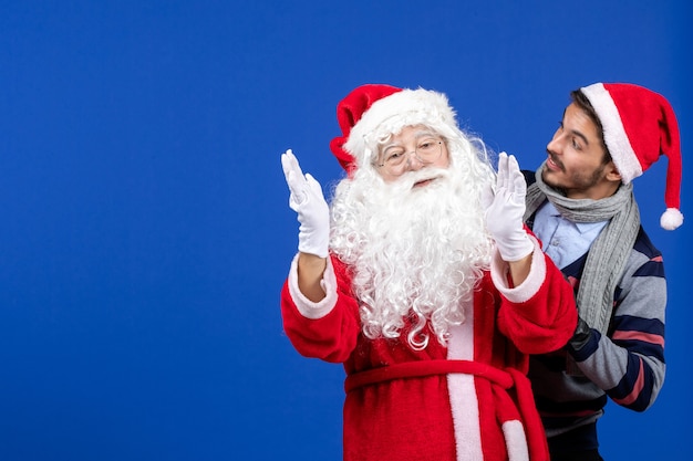 Front view santa claus with young male