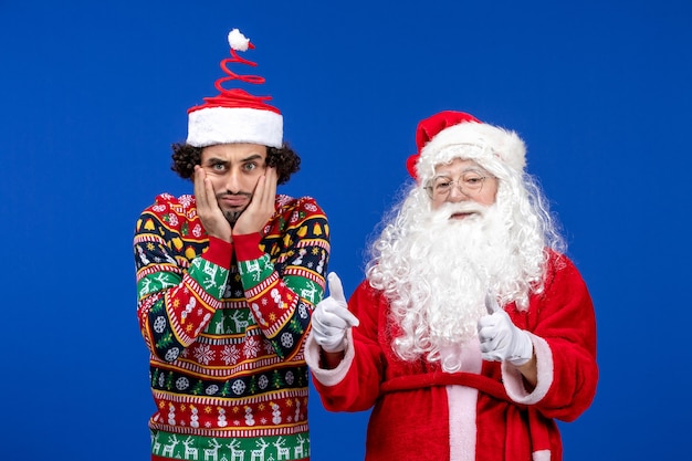 Front view santa claus with young male