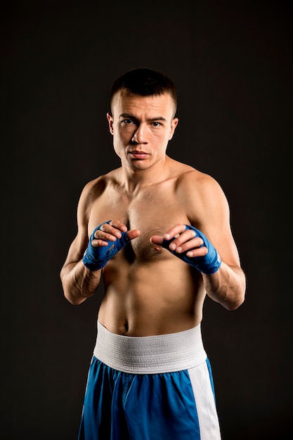 Free photo front view of shirtless male boxer