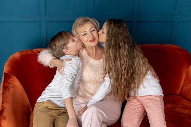 Front view siblings spending time together with their grandma