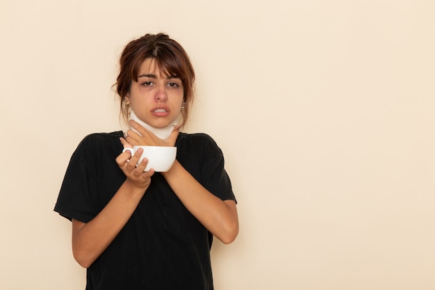 Free photo front view sick young female feeling very ill and drinking herb tea on light white surface