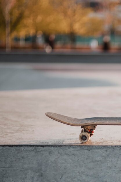 Front view of skateboard outdoors at the skatepark with copy space