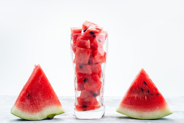 A front view sliced fresh watermelon sweet and mellow on white desk