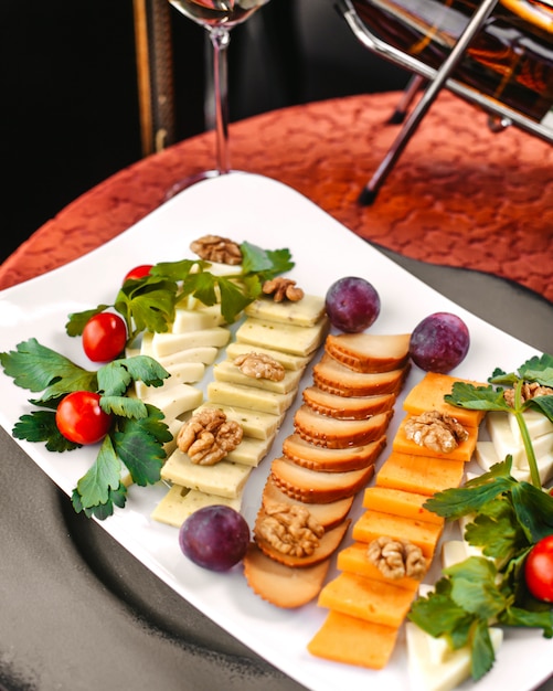 Free photo a front view sliced meals different dishes inside white plate on the table