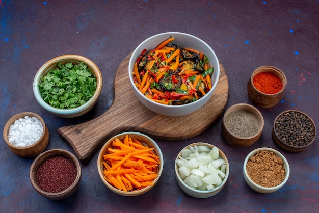 Free Photo front view sliced vegetable salad inside plate with greens seasonings on dark desk salad food meal vegetable