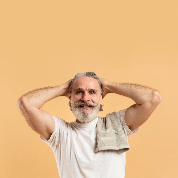 Front view of smiley attractive elder bearded man