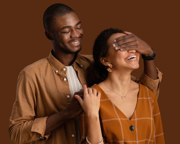 Front view of smiley couple posing together and having fun