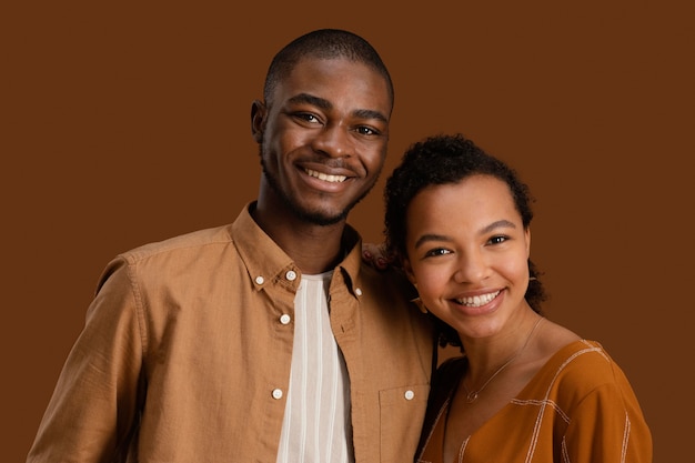 Front view of smiley couple posing together