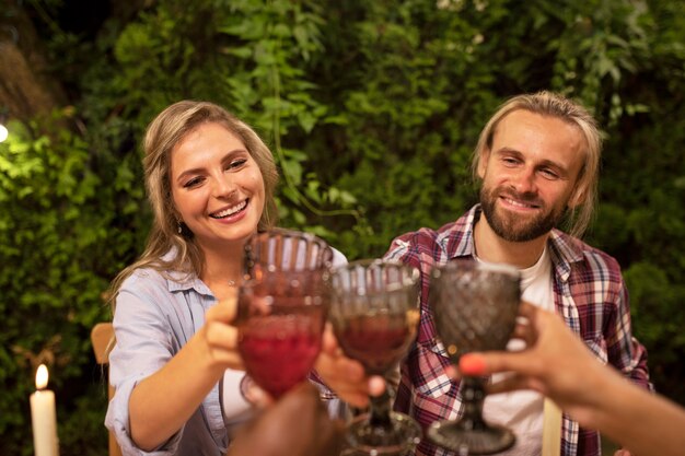 Front view smiley friends with drinks