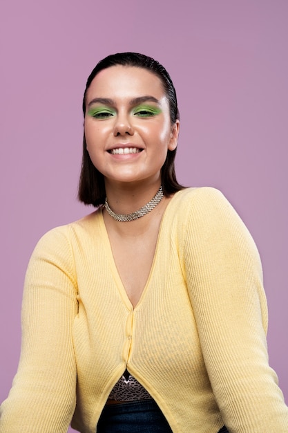 Front view smiley girl posing in studio