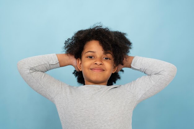 Front view smiley girl with blue background