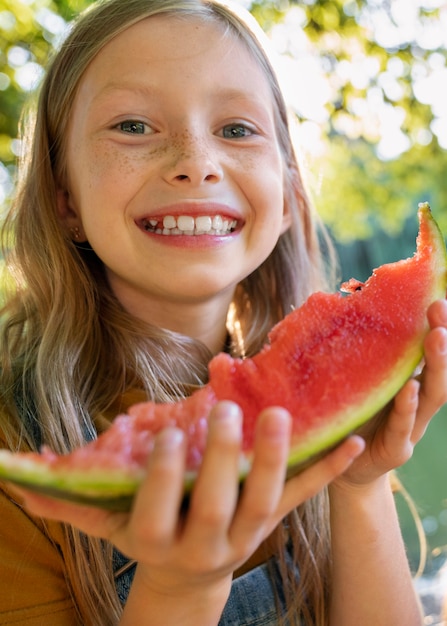 Front view smiley girl with watermelon