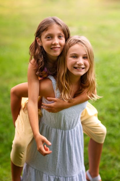 Front view smiley girls in nature