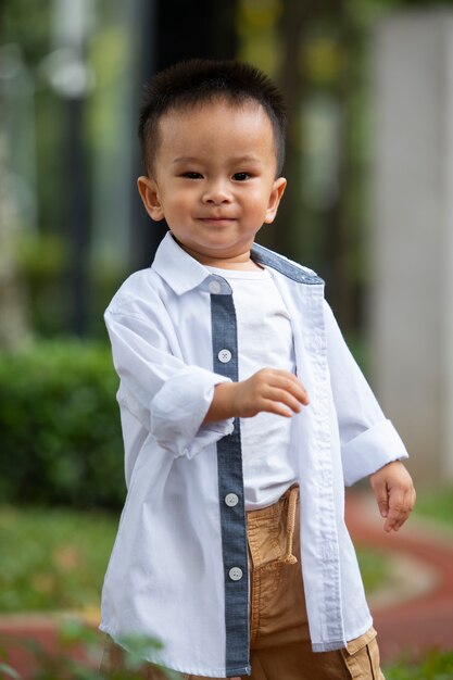 Front view smiley kid outdoors