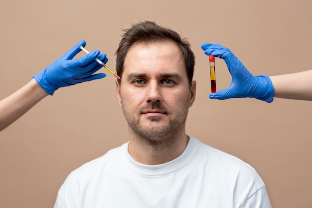 Front view smiley man getting prp injection