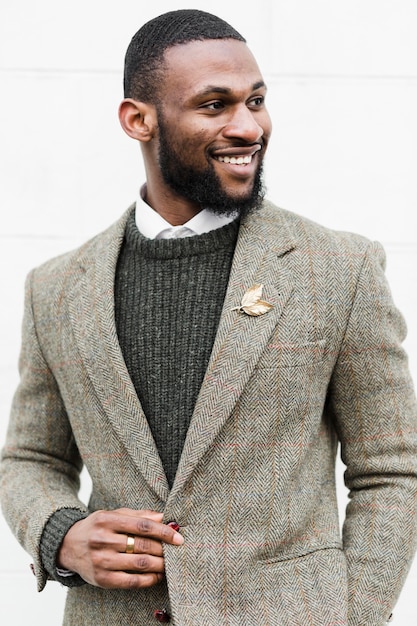 Front view smiley man posing in formal clothes