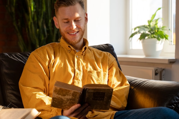 Front view smiley man reading