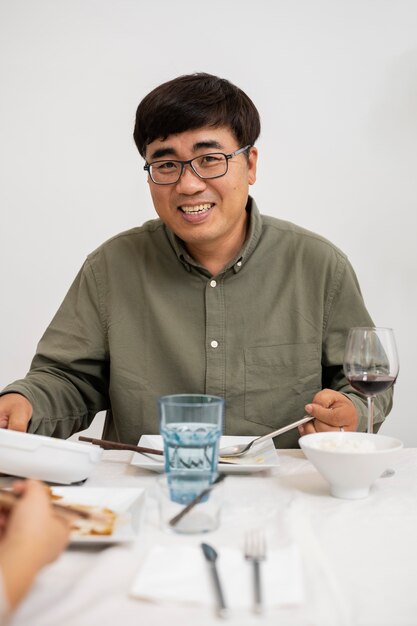 Front view smiley man at table