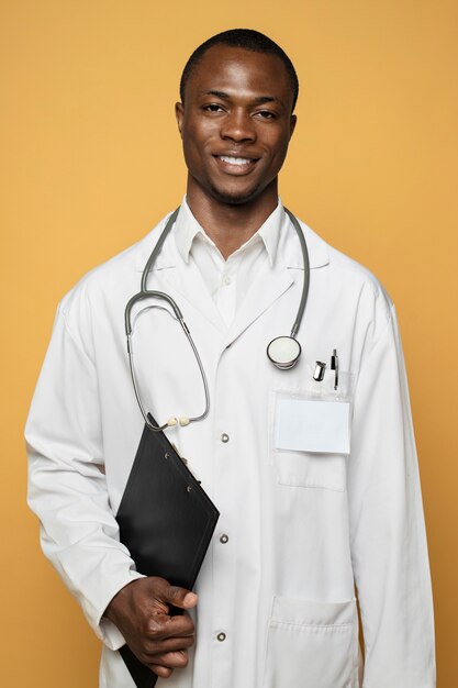 Front view smiley man wearing lab coat