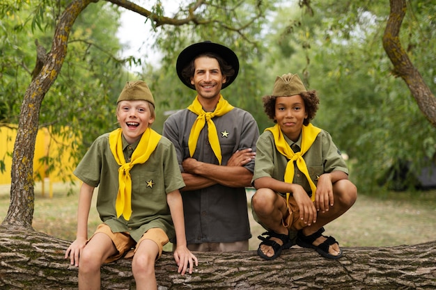 Free photo front view smiley scouts posing