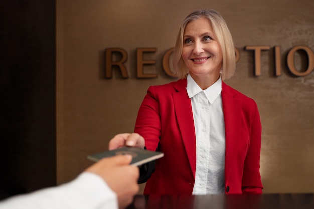 Front view smiley woman holding passport