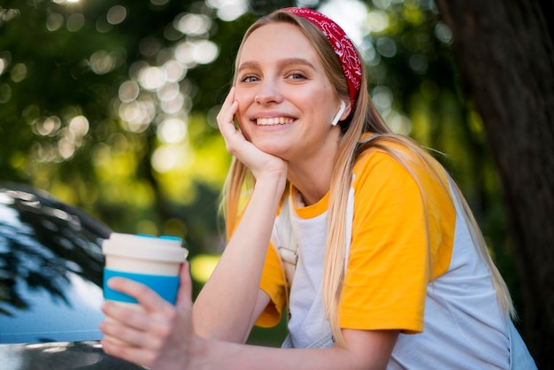 Front view of smiley woman in nature