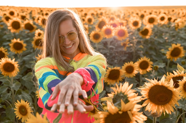 Front view smiley woman posing in nature